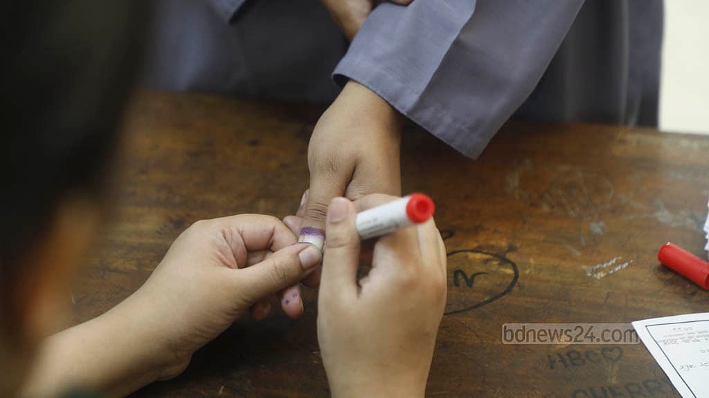 Election officials mark voters’ hands with indelible ink during a mock voting exercise at Sher-e-Bangla Nagar Government Girls’ High School, Dhaka, on Saturday. Photo: Abdullah Al Momin
