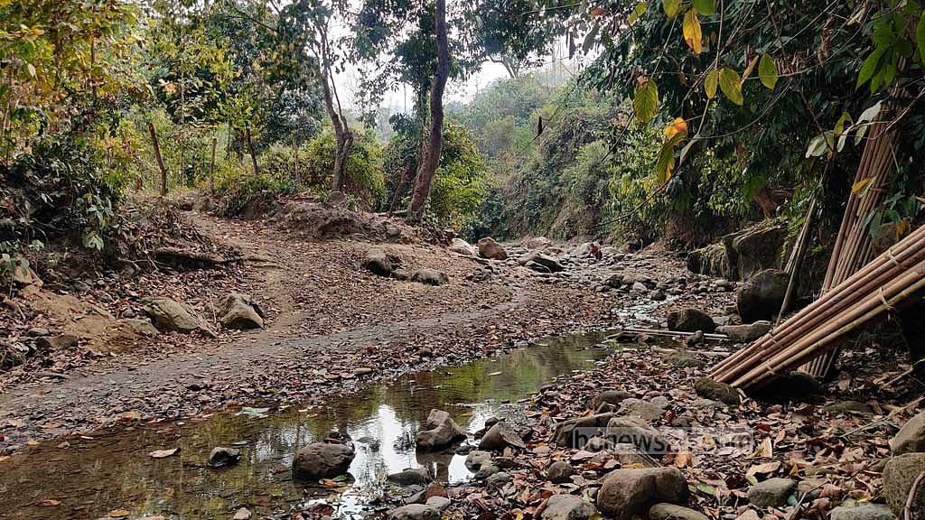 A dried-up stream near the hostel. Only stones remain, but no water. As a result, the students and the villagers are suffering from a severe water crisis.