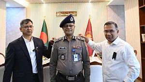 PM pins rank badge on new IGP Ali Hossain