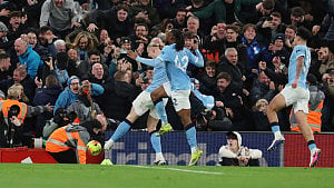 City snatch chaotic win at Liverpool to stay close to Arsenal