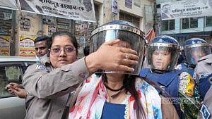 Police cover Sabina’s mouth outside court