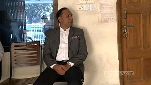 State minister sits waiting as land office opens late