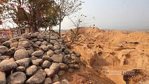 Plundered hill turns into cratered wasteland