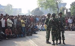 Army personnel are deployed to keep order at the Shajahanpur Police Station on March 3 
