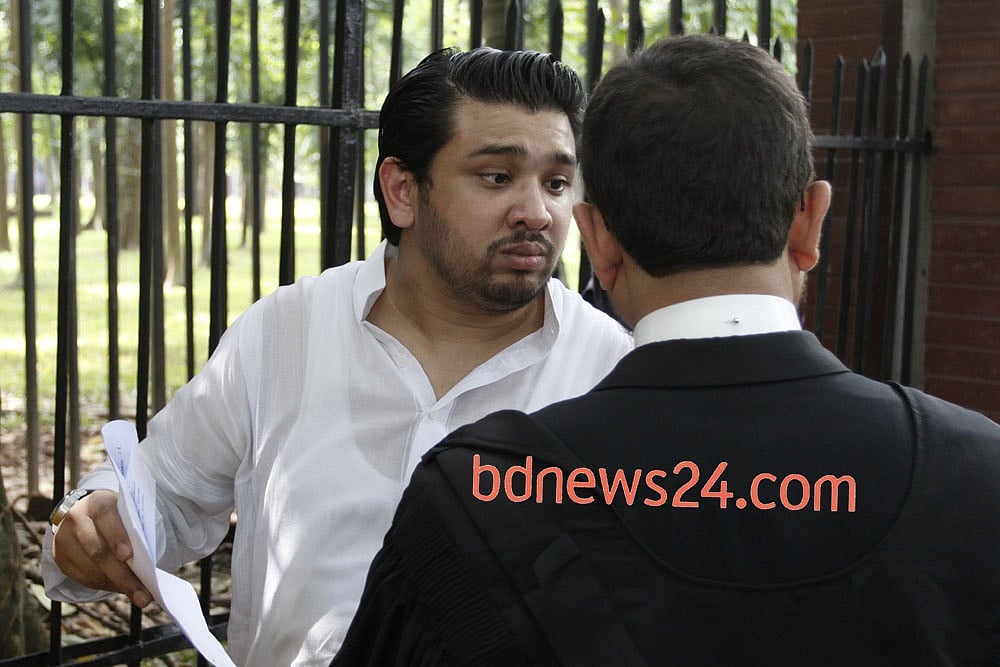 Salauddin Quader's son Hummam Quader Chowdhury with a 'copy of the verdict' in his hand at the court premises. File photo. 
