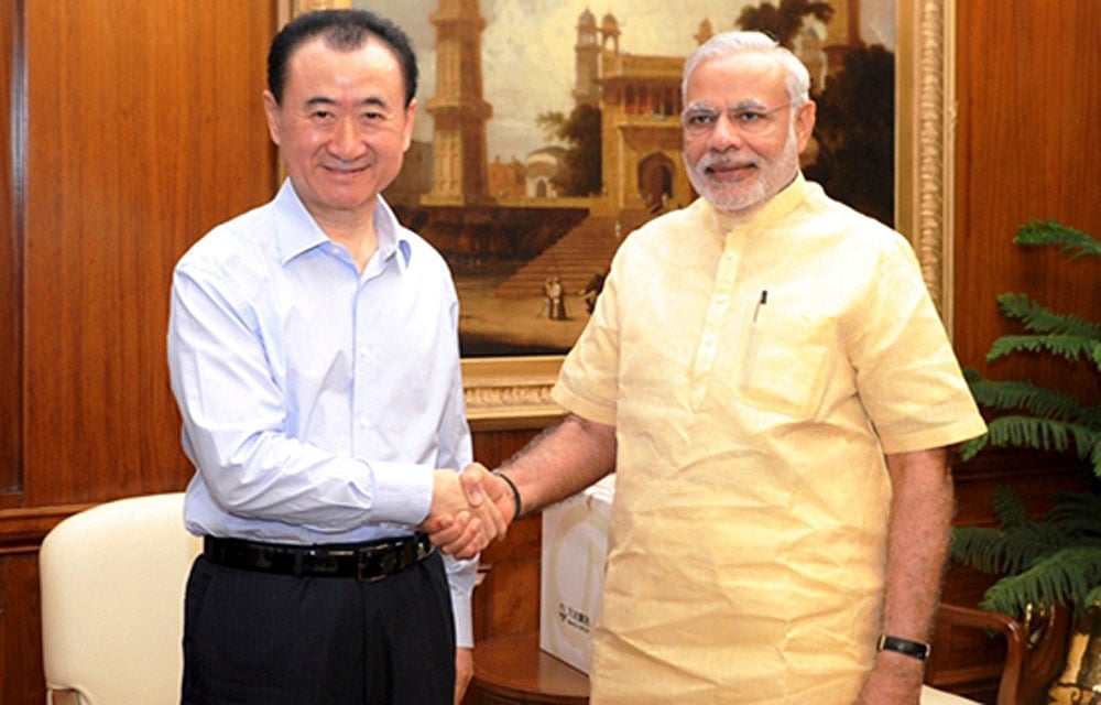 Indian Prime Minister Narendra Modi shakes hands with Wang Jianlin (L) in this photo taken from Twitter feed of @PMOIndia Indian Prime Minister Narendra Modi shakes hands with Wang Jianlin (L) in this photo taken from Twitter feed of @PMOIndia