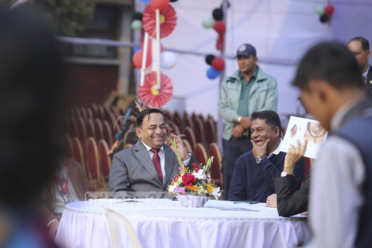 RAB chief Benazir Ahmed (red tie) is all smiles 