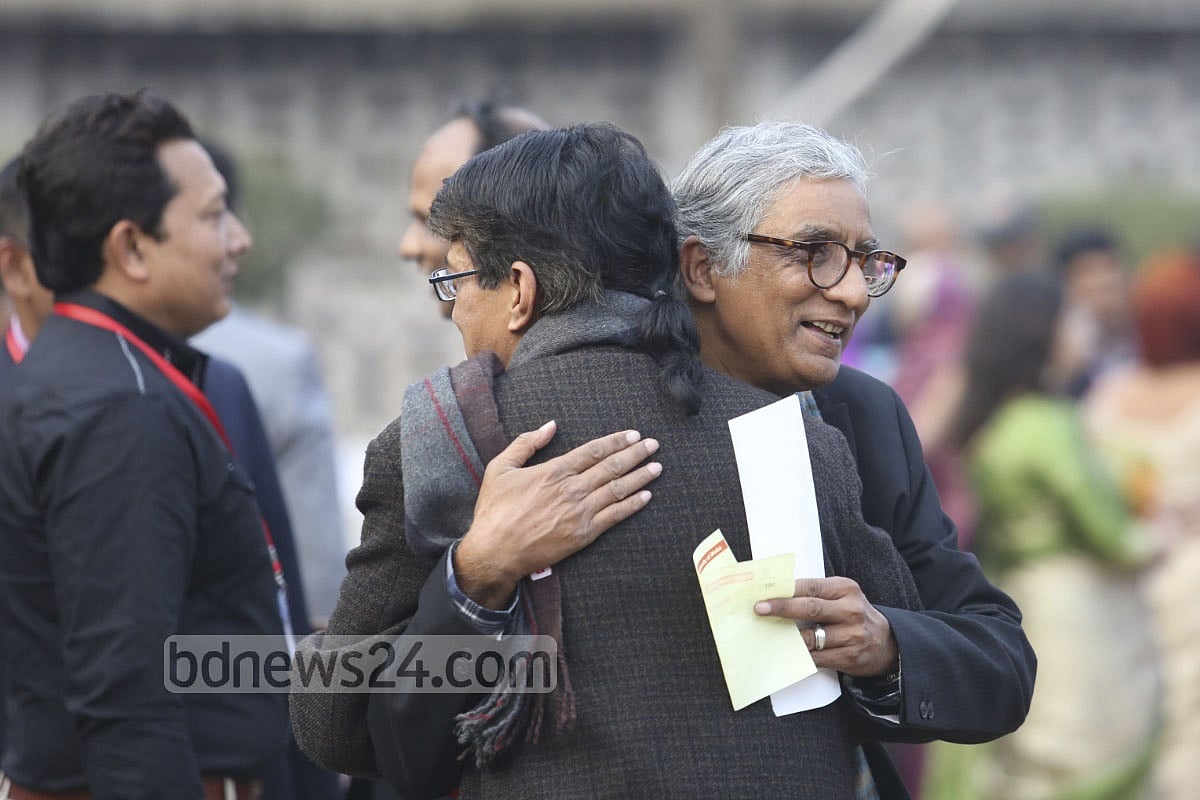 Professor Shawkat Hossain hugs his junior in the department Azfar Hossain 