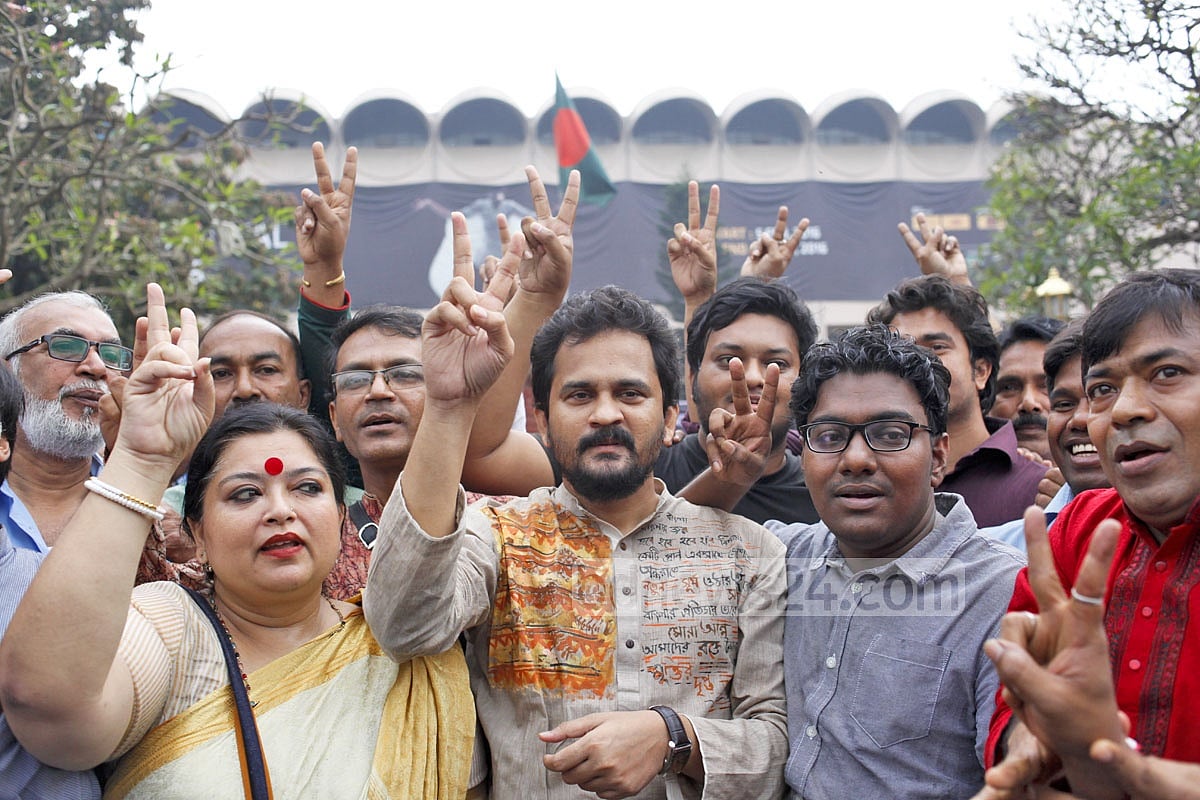 Ganajagaran Mancha activists flash the victory sign after the top appeals court delivered Mir Quasem's appeal verdict. 