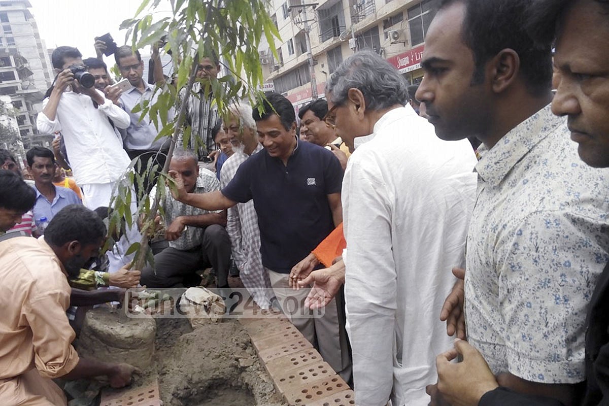 Planting a sapling as part of his 'Green Dhaka' campaign, a year into office. 