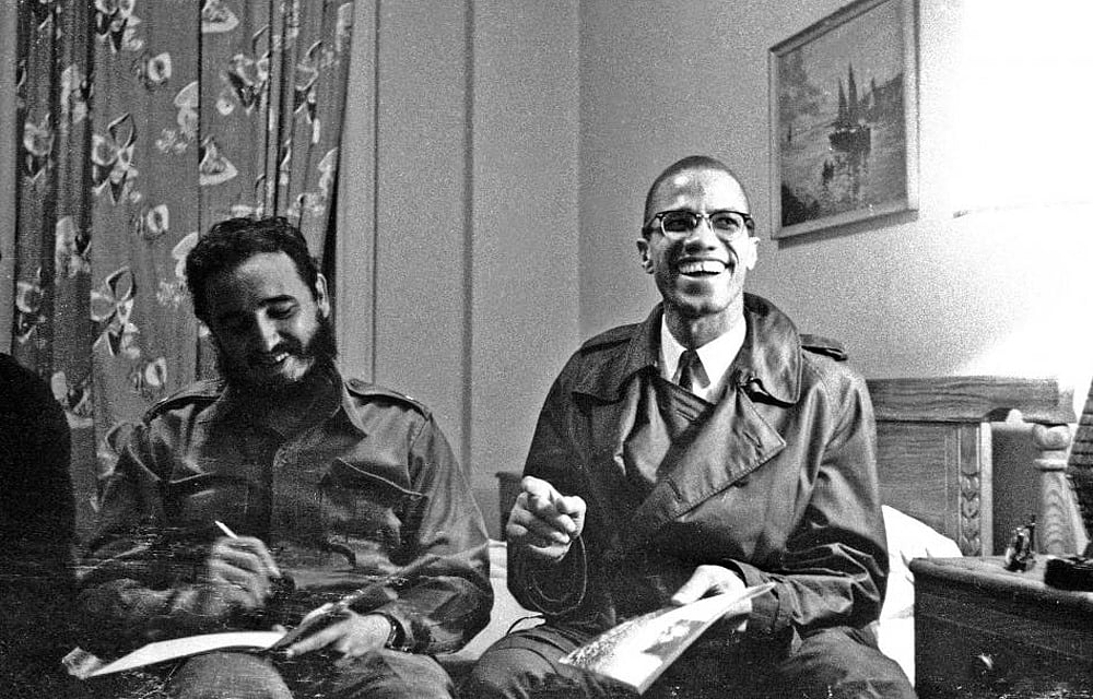 Fidel Castro shares a laugh with Malcolm X at the Hotel Theresa in New York, October 19, 1960. Reuters 