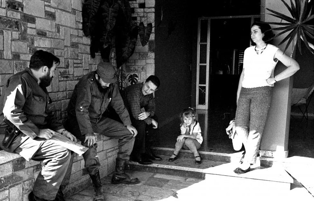 (L-R) Manuel Pineiro, Fidel Castro, Raul Castro, an unidentified girl and Vilma Espin together in Havana in this undated file photo. Reuters 