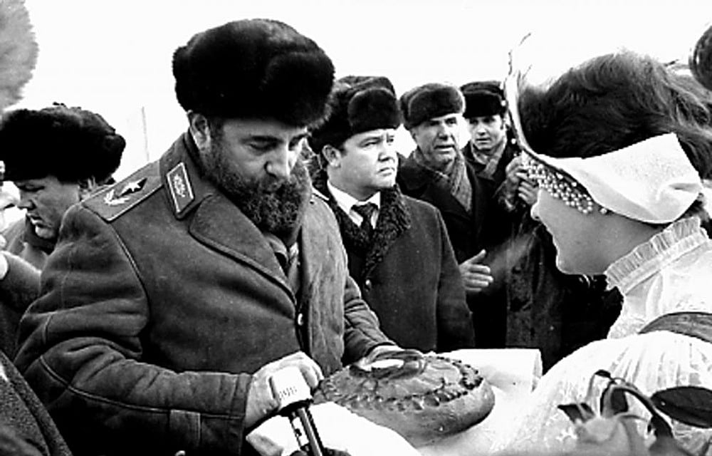 Fidel Castro breaks a piece of bread offered to him before the XXVI Congress of the Soviet Union's Communist Party, outside Moscow in February 1981. Reuters 