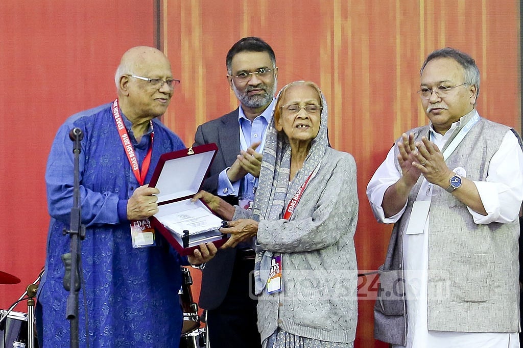 Finance Minister AMA Muhith, the oldest alumnus present who did his MA in 1955, hands a crest over to retired professor Husniara Haq. Finance Minister AMA Muhith, the oldest alumnus present who did his MA in 1955, hands a crest over to retired professor Husniara Haq.