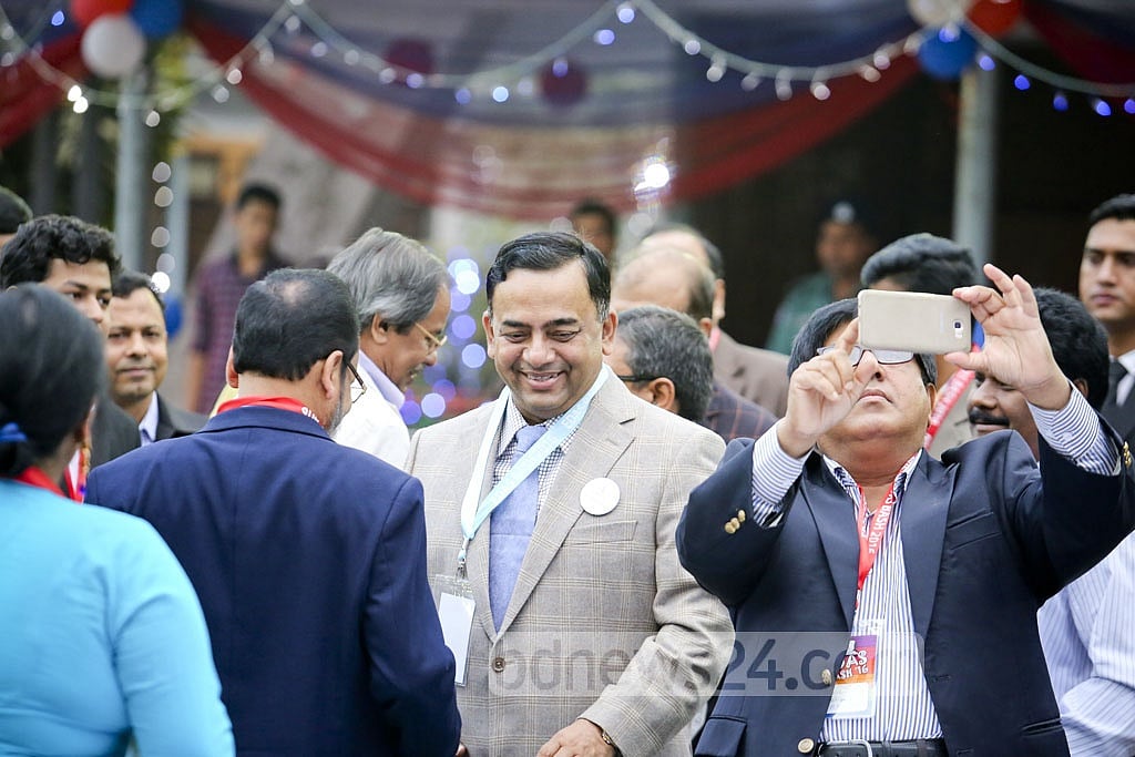RAB Director General Benazir Ahmed smiles while chatting with friends. RAB Director General Benazir Ahmed smiles while chatting with friends.