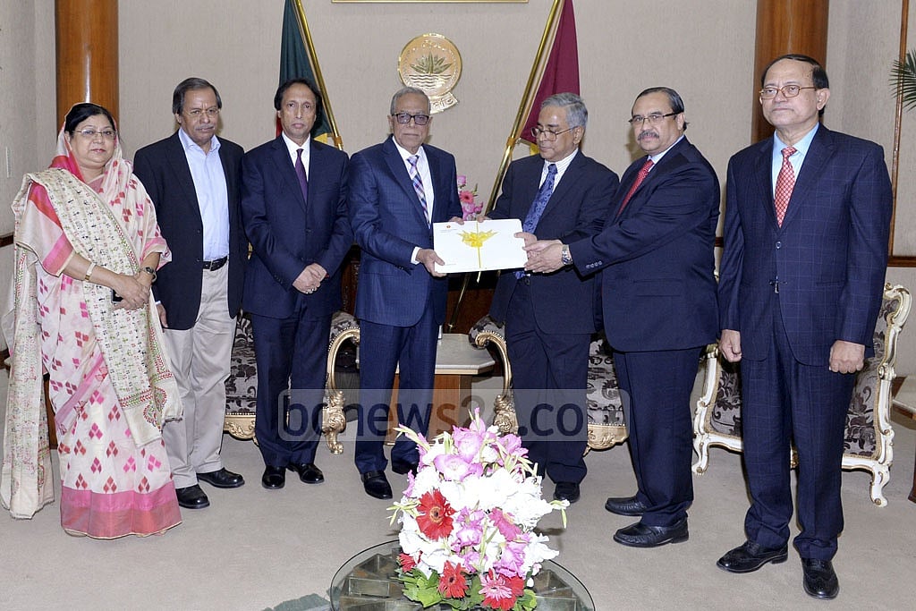 The six-member search panel handing over its recommendations to President Md Abdul Hamid at the Bangabhaban. 