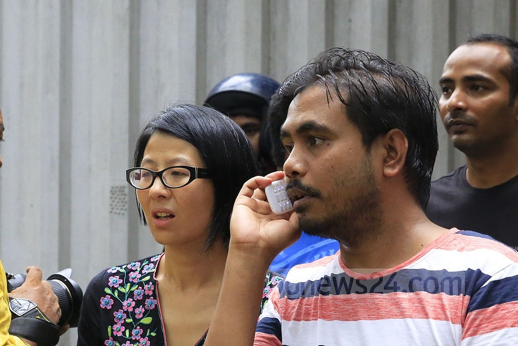 A Japanese woman was seen among foreign nationals who waited outside. Of the café's 20 victims, seven were Japanese.      