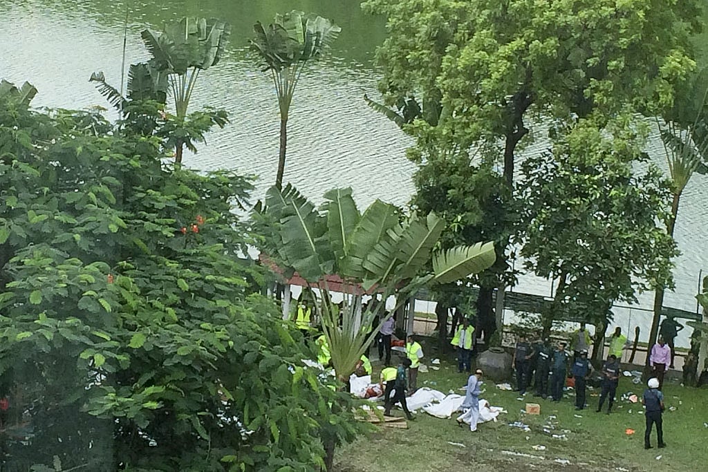 Body bags were lined up on Holey's much-loved green lawn.  