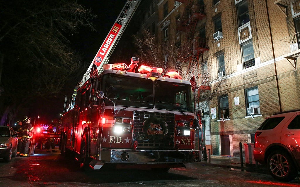 Fire in New York City apartment block kills 12 including an infant