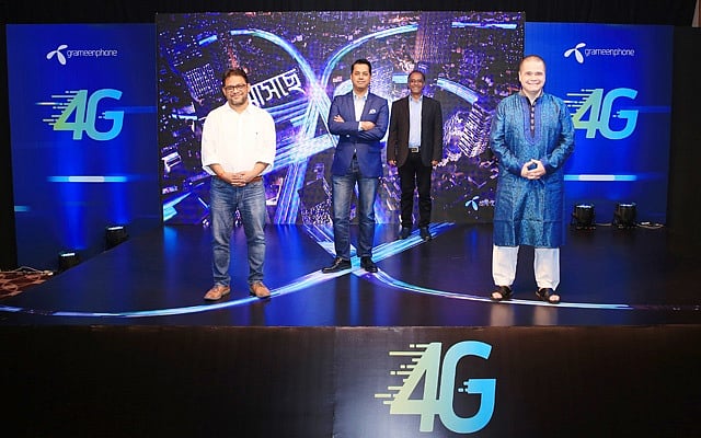 Grameenphone CEO Michael Foley along with other officials posing for the media on the 4G track. Foley announced that the company was ready to launch 4G as soon as the license handover and was committed to provide best customer experience on a new modernised network. Photo: GP handout 