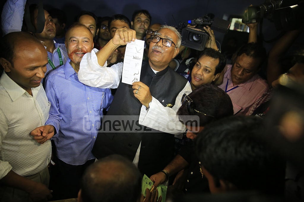 Talukdar Abdul Khalek shows a ballot paper before casting his vote. Photo: Mostafigur Rahman 