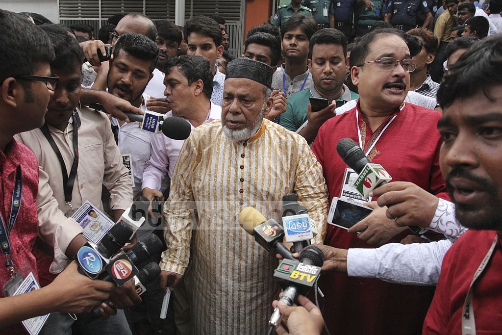 Emerging from the polling centre, BNP's mayoral candidate Hasan Uddin Sarker meets the reporters on Tuesday. Photo: Asif Mahmud Ove 