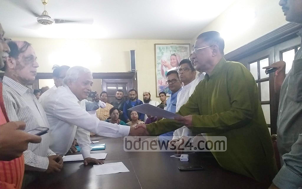 Jatiya Oikya Front leader Jaglul Haider Afrik handing Awami League a list to Awami League Joint General Secretary Abdur Rahman on Tuesday. The list was of the Front leaders who will attend the talks with Awami League chief Sheikh Hasina at the Ganabhaban on Thursday. 