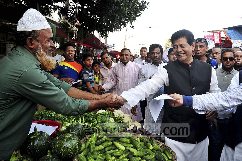 Awami League candidate and former film star Farooque engages with voters. 