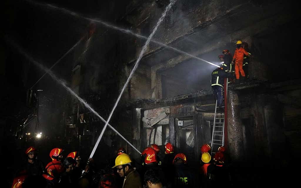 Firefighters work at the scene of a fire that broke out at a chemical warehouse in Dhaka, Bangladesh February 21, 2019. Reuters 
