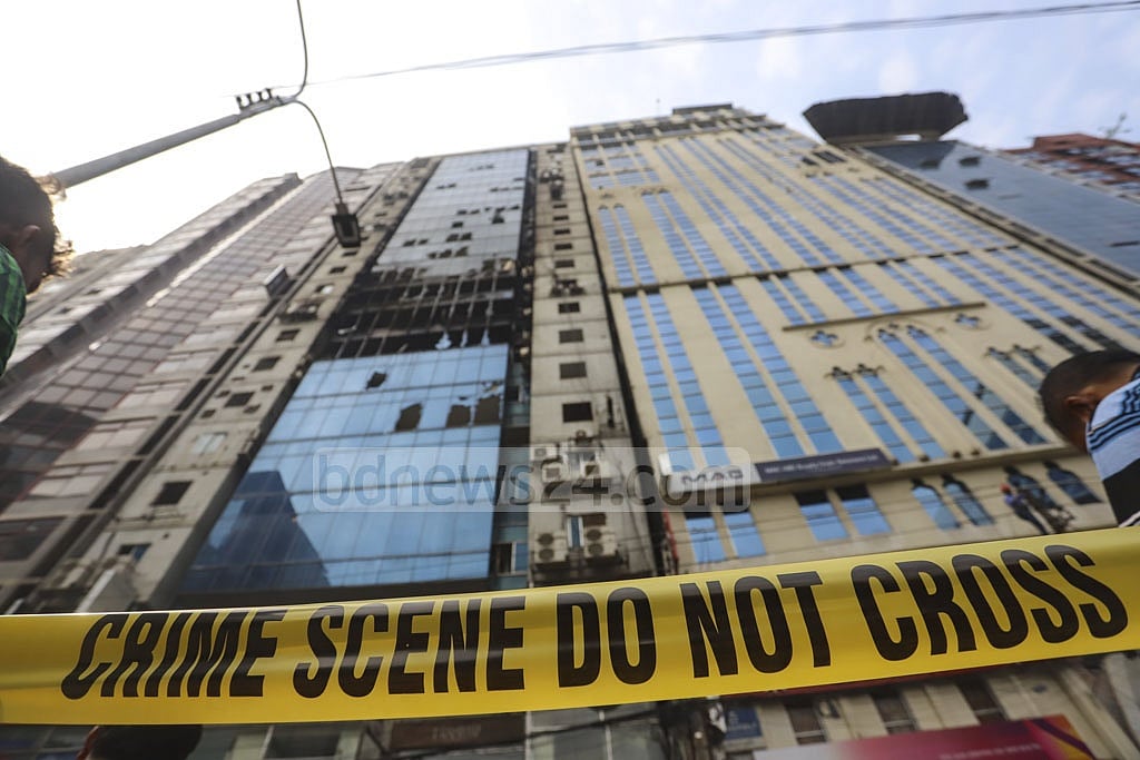 The scene of the devastating fire in Dhaka's Banani is cordoned off with a yellow tape on Friday. Photo: Asif Mahmud Ove 