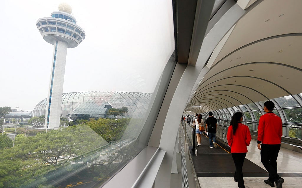 The 40-metre high Rain Vortex, which is the world's tallest indoor waterfall, is seen from inside Jewel Changi Airport in Singapore, April 11, 2019. Reuters 