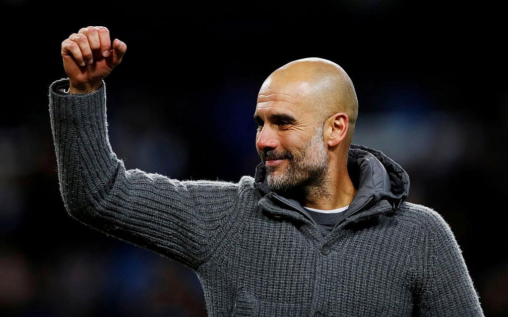 File Photo: Manchester City manager Pep Guardiola has helped raise more than 6000 pounds for the Premier League team’s City in the Community charity by donating for auction the grey cardigan he wore during their treble-winning campaign last season. Reuters 