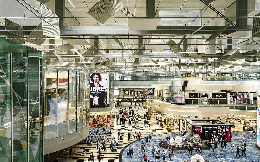 The Terminal 3 transit area at Singapore Changi Airport, Nov. 6, 2019. With a soaring waterfall, forests, endless shops and restaurants, and even a sound-and-light show, a few hours’ layover in Changi Airport may not be enough time. (Lauryn Ishak/The New York Times) 