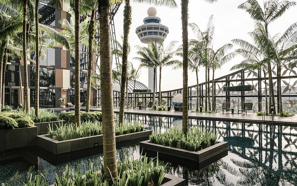 The Crowne Plaza at Singapore Changi Airport, Nov. 6, 2019. With a soaring waterfall, forests, endless shops and restaurants, and even a sound-and-light show, a few hours’ layover in Changi Airport may not be enough time. (Lauryn Ishak/The New York Times) 
