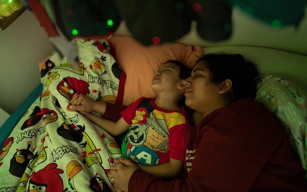 Rebecca Trimble prays with her boys during bedtime, in Bethel, Alaska, March 8, 2020. (Ash Adams/The New York Times) Rebecca Trimble prays with her boys during bedtime, in Bethel, Alaska, March 8, 2020. (Ash Adams/The New York Times)