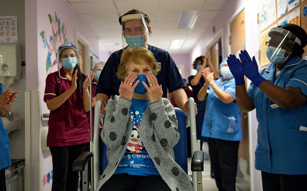 In COVID-19 milestone for West, Britain starts mass vaccination