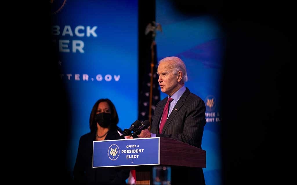 As his predecessor is impeached, Biden tries to stay above the fray