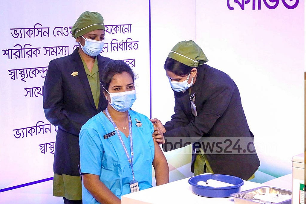 Jan 27, 2021: Runu Veronica Costa, a nurse of the Kurmitola General Hospital in Dhaka, received the first COVID-19 vaccine shot in Bangladesh, as the government rolled out a mass immunisation campaign. She was also the first one to receive a booster dose of the vaccine at the end of the year. Photo: PMO Jan 27, 2021: Runu Veronica Costa, a nurse of the Kurmitola General Hospital in Dhaka, received the first COVID-19 vaccine shot in Bangladesh, as the government rolled out a mass immunisation campaign. She was also the first one to receive a booster dose of the vaccine at the end of the year. Photo: PMO