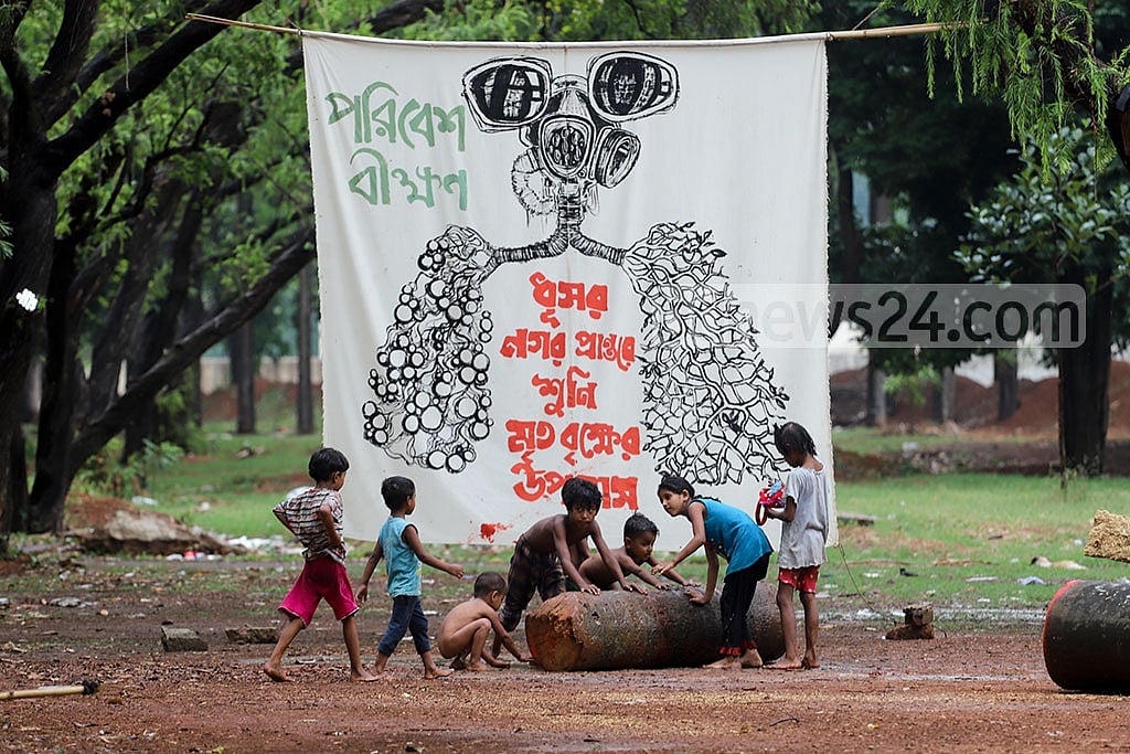  May O5, 2021: Trees have been hacked down to construct a restaurant, walkways and a parking zone as part of the project to construct Swadhinata Stambha or Independence Monument at Suhrawardy Udyan. Protesters demonstrate against the felling of trees at the park for beautification. Photo: Asif Mahmud Ove  May O5, 2021: Trees have been hacked down to construct a restaurant, walkways and a parking zone as part of the project to construct Swadhinata Stambha or Independence Monument at Suhrawardy Udyan. Protesters demonstrate against the felling of trees at the park for beautification. Photo: Asif Mahmud Ove
