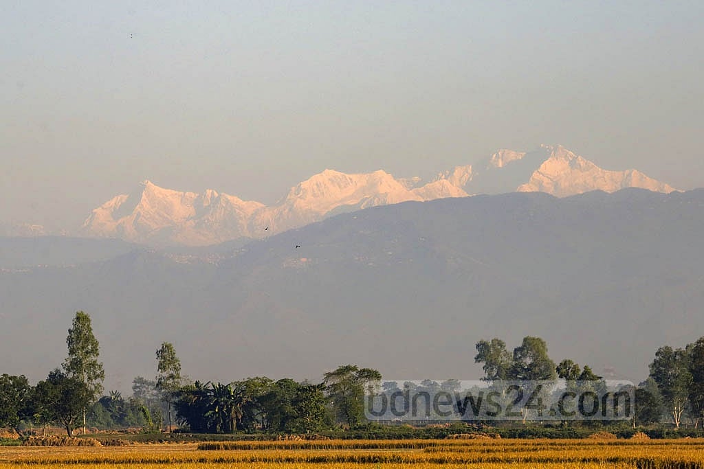 The view of Kanchenjunga’s snow-covered peak begins to change after sunrise.  