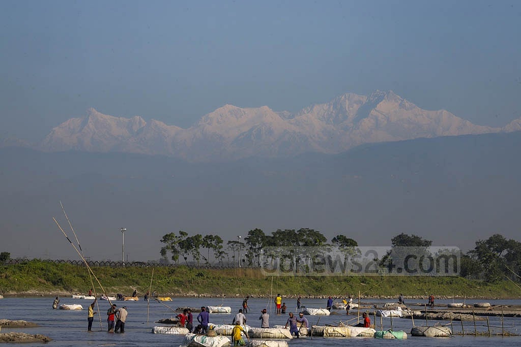 A clear view of Mount Kanchenjunga from a bungalow on the bank of the Mahananda River. 