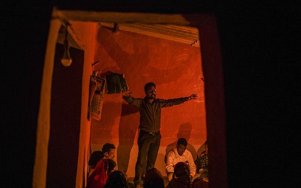 Vinod Patil, a Pentecostal preacher who has been threatened with death by Hindu extremists if they catch him preaching, conducts a secret prayer meeting in the state of Madhya Pradesh, India, March 31, 2021. The New York Times 
