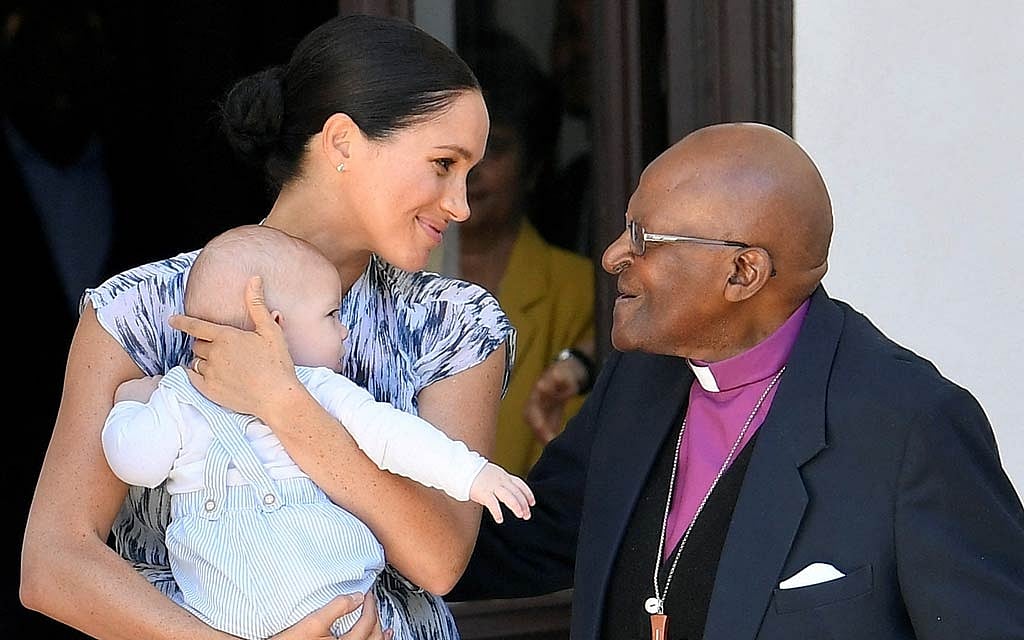 FILE PHOTO: Britain's Meghan, Duchess of Sussex, holding her son Archie, meets Archbishop Desmond Tutu at the Desmond & Leah Tutu Legacy Foundation in Cape Town, South Africa, September 25, 2019. REUTERS/Toby Melville/Pool/File Photo 