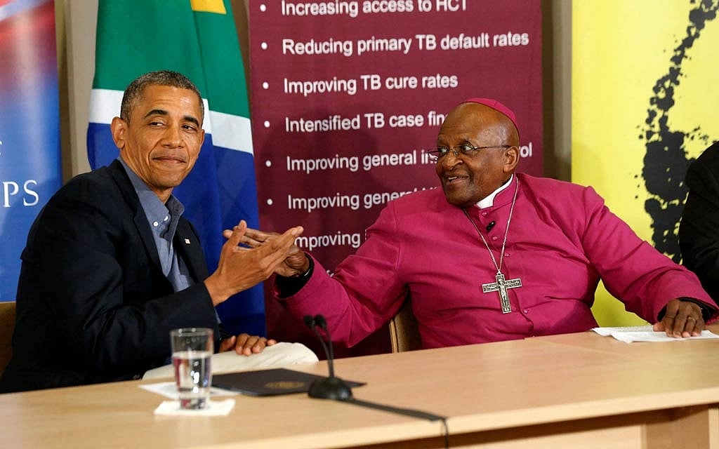 FILE PHOTO: US President Barack Obama (L) is pictured alongside Desmond Tutu as he visits his HIV Foundation Youth Centre and takes part in a health event with youth in Cape Town, June 30, 2013. REUTERS/Jason Reed/File Photo 